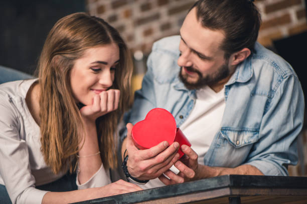 istock Man gives gift to his girlfriend 653820050