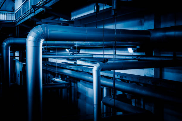 istock steel pipelines and cables in a plant 653821098