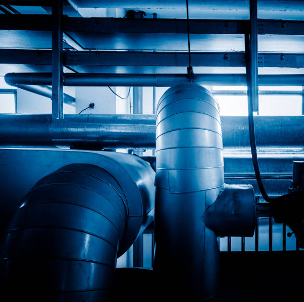 istock steel pipelines and cables in a plant 653821162