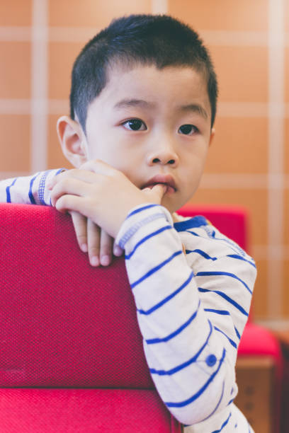 istock Cute boy concentrating in meeting room 653822318