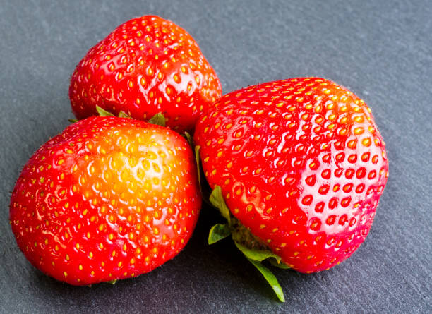 istock Strawberryes on wooden dark background. 653826746