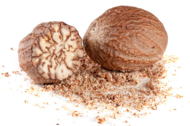 istock two nutmeg and powder isolated on white background 653829216