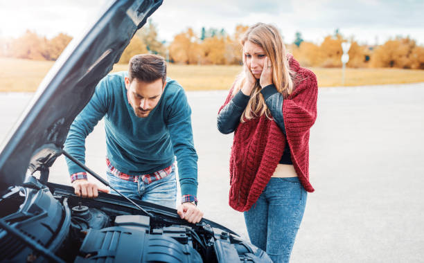 istock Problem with a car. A broken car on the road. Traveling and transportation concept 653829380