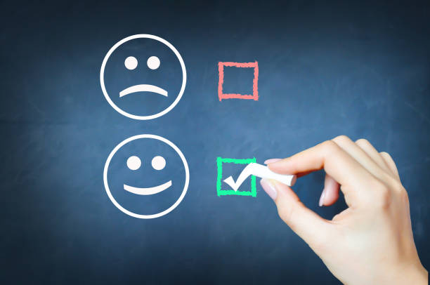 istock Choose to be happy with tick against smiley face on chalkboard 653837762
