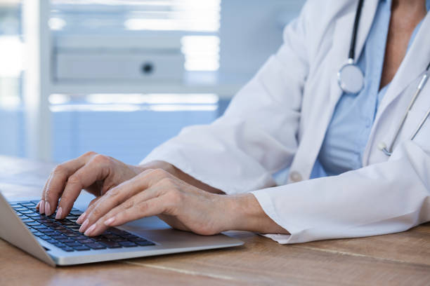 istock Female doctor working on her laptop 653839268
