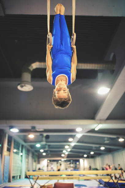 istock Boy exercising on gymnastic rings 653840022