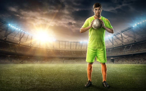 istock soccer player with soccer ball in his hands 653840508