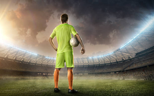 istock soccer player with soccer ball 653840526
