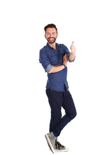 The man lay and thumbs up on the white background. View from above