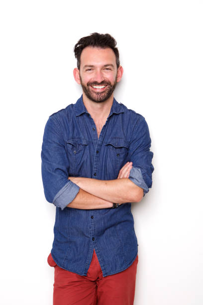 istock Stylish mature guy posing with arms crossed and smiling 653844272