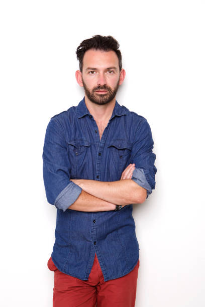 istock Handsome mature guy posing with arms crossed 653844336