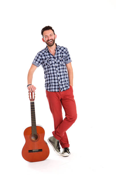 istock Smiling mature man with guitar 653844434
