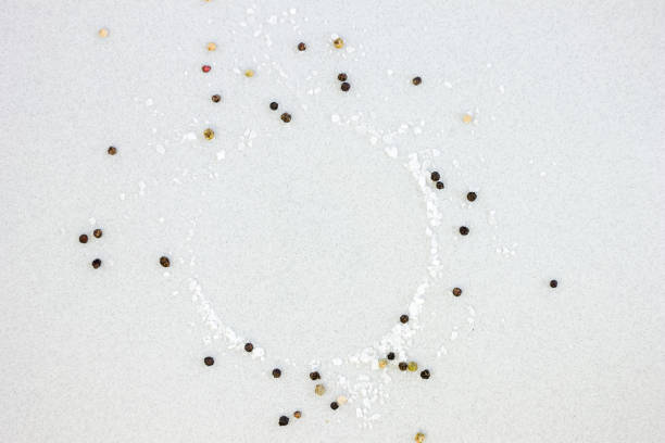 Spices and sea salt over grey background