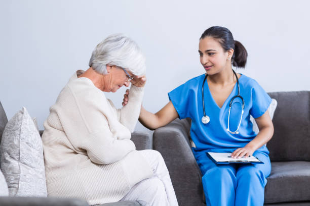 istock Doctor consoling senior patient 653848010