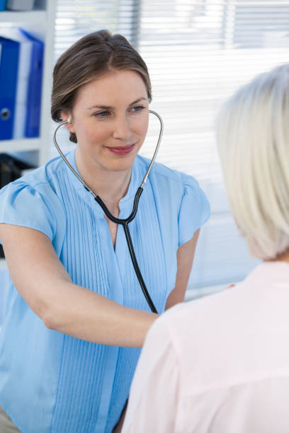 istock Doctor examining a patient with stethoscope 653850182