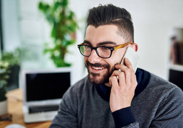 istock Making some calls, sealing some deals 653850220