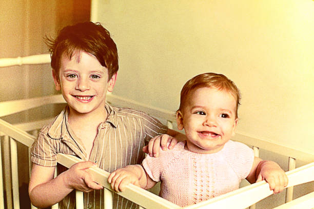 istock Vintage brother and sister weaking up 653851266