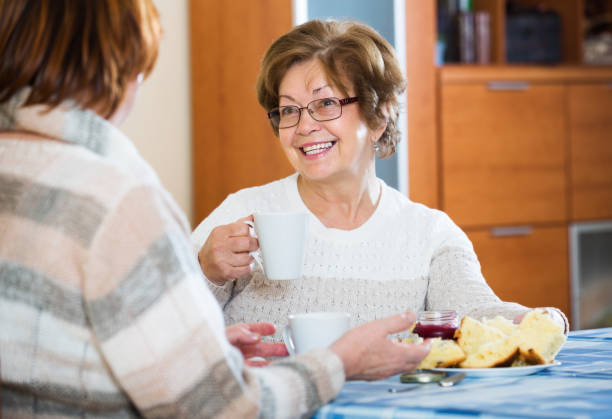 istock Mature women sitting and chatting 653851530