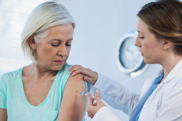 istock Doctor giving injection to patient 653851954
