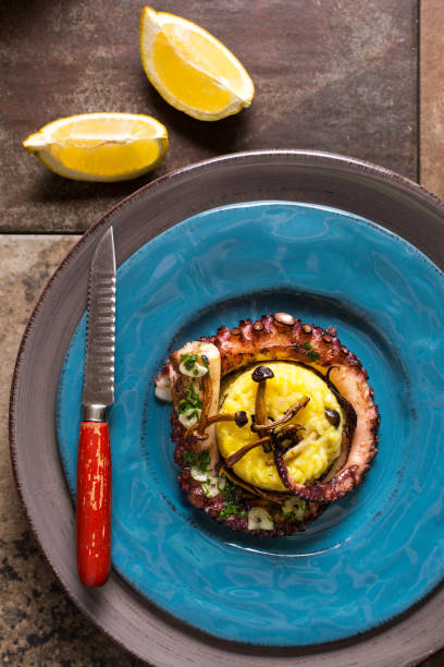 istock Grilled Seafood Octopus on Saffron Risotto with Brown Shimeji Mushrooms 653852410
