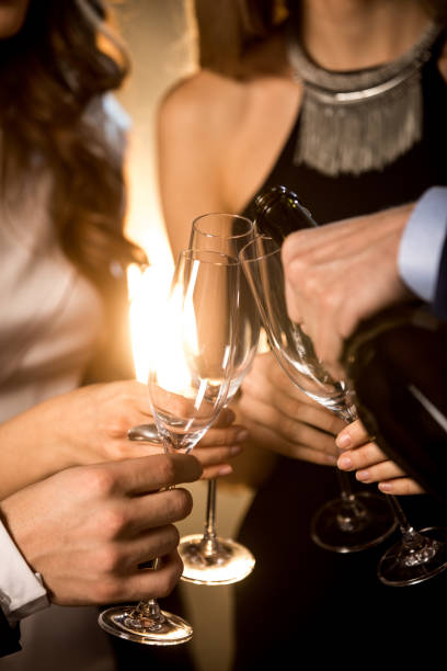 istock Happy friends drinking champagne 653852758
