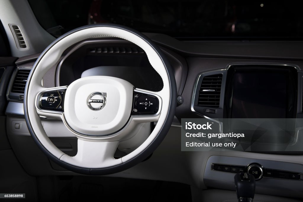 Steering wheel of the modern car Volvo XC90 Saint-Petersburg, Russia - February 16, 2017: Steering wheel of the modern luxury swedish car Volvo XC90 white leather interior on the test-drive in Sankt-Petersburg at february 16 2017 Volvo Stock Photo
