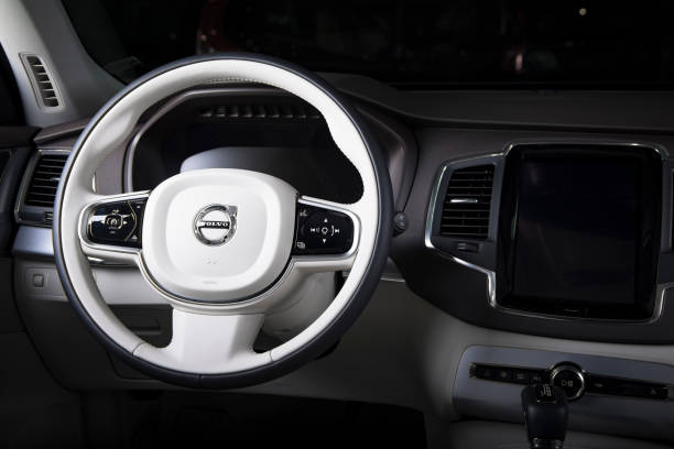Steering wheel of the modern car Volvo XC90 Saint-Petersburg, Russia - February 16, 2017: Steering wheel of the modern luxury swedish car Volvo XC90 white leather interior on the test-drive in Sankt-Petersburg at february 16 2017 volvo photos stock pictures, royalty-free photos & images