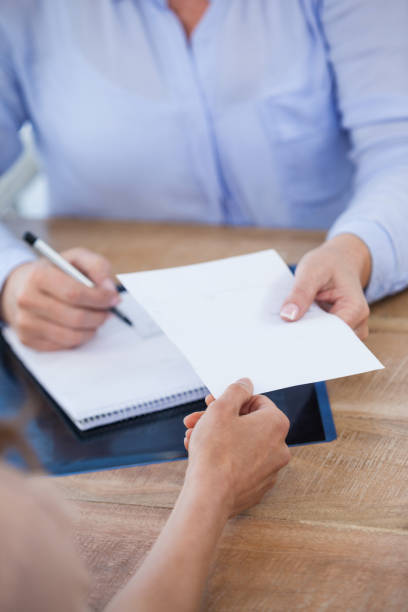 istock Doctor giving prescription to patient 653860314
