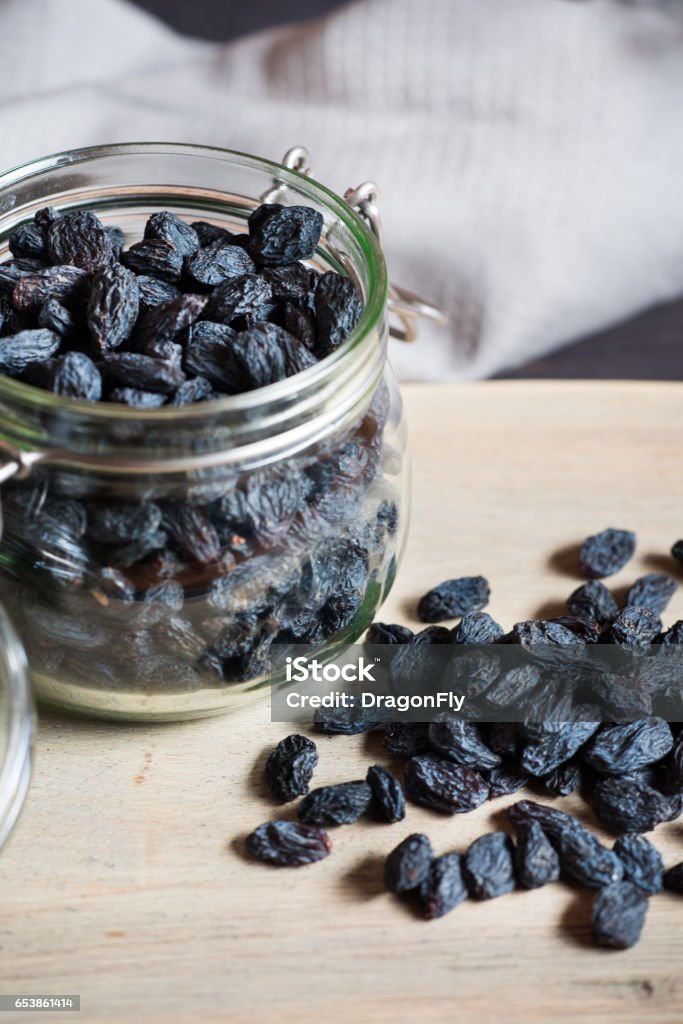 Black raisin Natural organic dried grapes raisins. Black raisin. Backgrounds Stock Photo