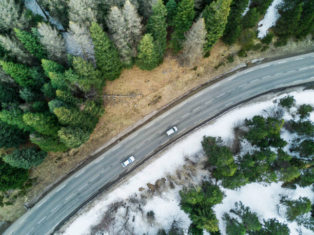 istock Aerial View Of A Road In Winter Forest 653861506