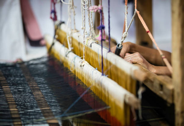 istock colorful weave on a wooden loom 653863672