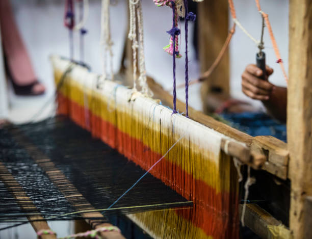 istock colorful weave on a wooden loom 653863690