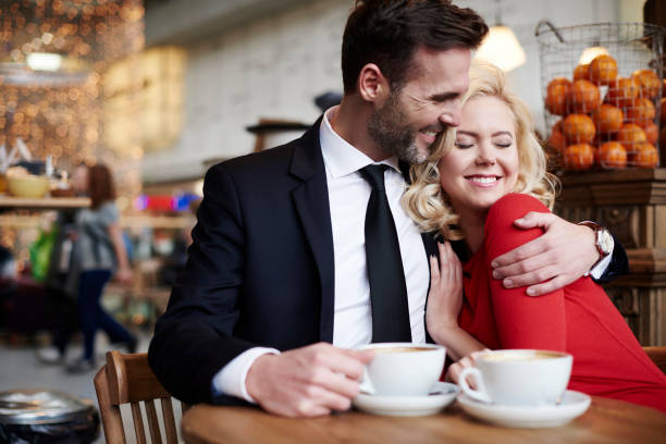 istock Couple hugging in the coffee bar 653864604