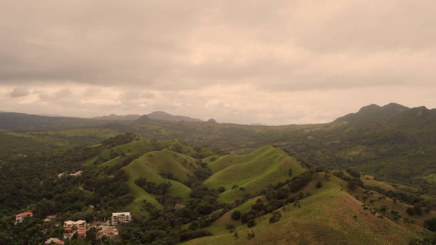 istock Hills with a village view from above 653866084