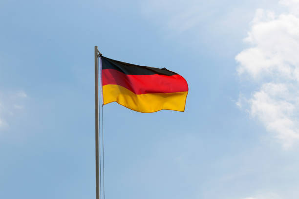 istock National flag of Germany on a flagpole 653867766