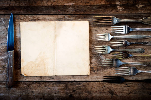 istock Vintage restaurant menu on a rustic wood background 653869550