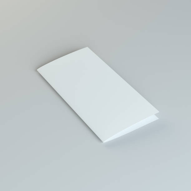 istock Lying blank two fold paper brochure on gray background 653870726