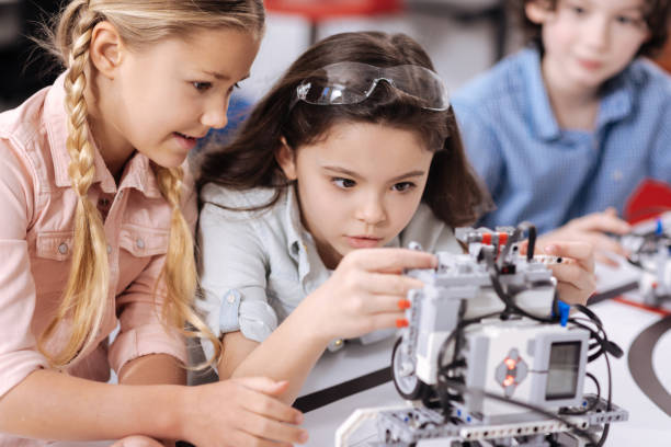 istock Involved children discussing project at school 653873444