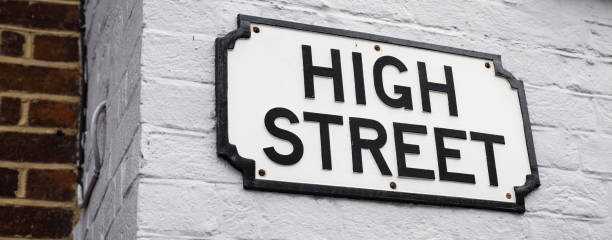 Traditional High Street sign A simple British High Street sign on a painted brick wall. high street stock pictures, royalty-free photos & images