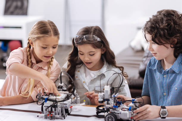 istock Enthusiastic kids enjoying discussion at school 653874542