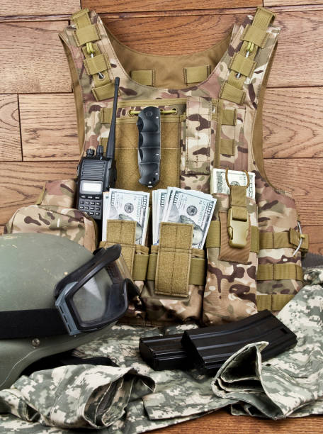dollars in military equipment dollars in military gear stock photo terrorist financing stock pictures, royalty-free photos & images