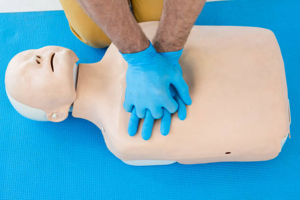 istock Paramedic practising cardiopulmonary resuscitation on dummy 653875074