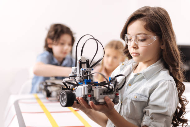 istock Concentrated girl having tech lesson at school 653875314