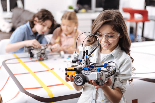 istock Joyful girl representing project at school 653875396