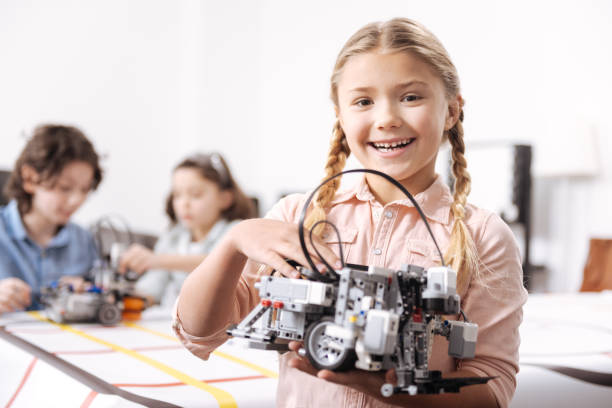 istock Humorous little girl representing project at school 653875448