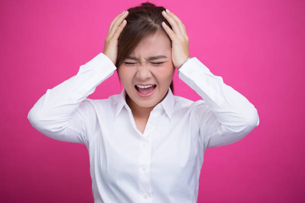 istock Angry woman screaming out and pulling her hair 653876134