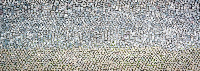 A background texture of cobbles in Paris, France.