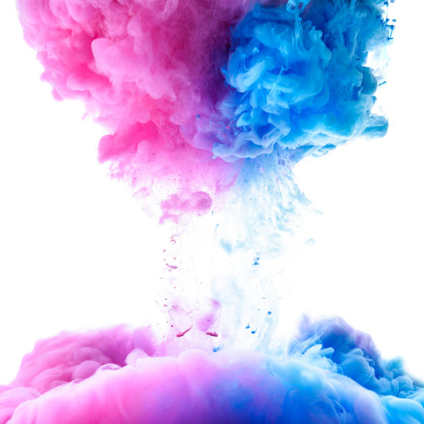 istock Pink and blue clouds of paint 653877768