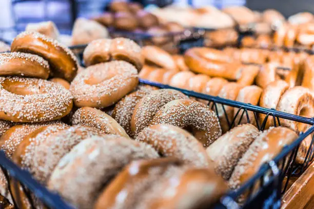 Closeup of many bagels in bakery