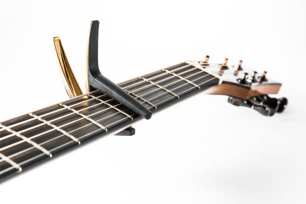 istock Acoustic guitar with gold capo 653879416
